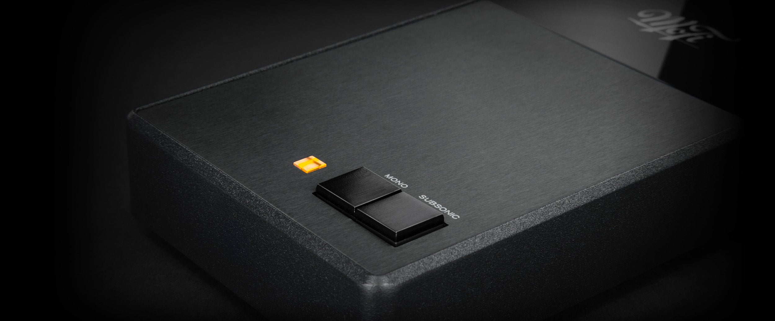 Detailed view of SutdioPhonos power light and Mono and Subsonic buttons.